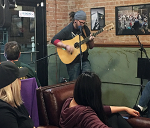 A Salt Lake City local performs at Alchemy Coffee.