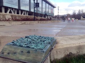 A sculpture of a book is displayed outside the Marriott Library