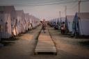 A woman walks among the tents at a refugee camp in Donetsk, Russia, on the border with&nbsp;Ukraine.